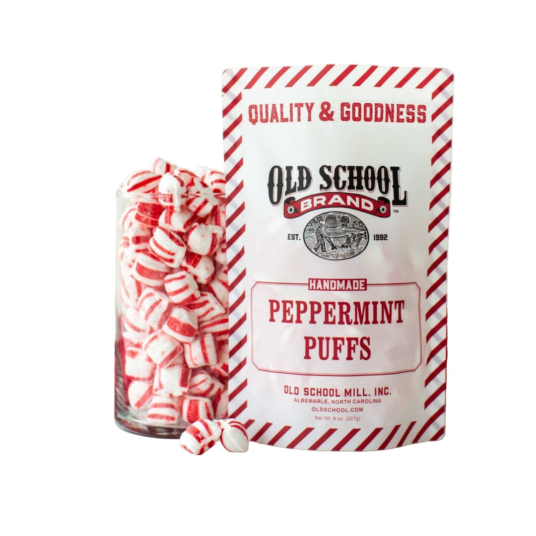 Peppermint Puffs bag with a jar full of candies on a white background