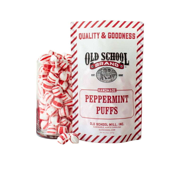 Peppermint Puffs bag with a jar full of candies on a white background
