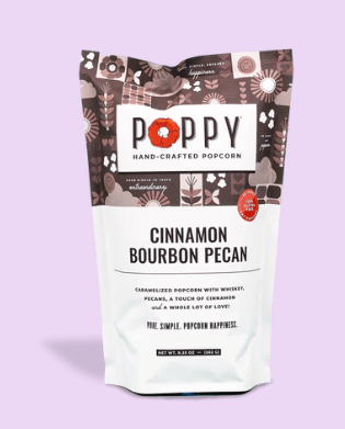 Poppy Hand Crafted Popcorn in Cinnamon Bourbon Pecan flavor on a light purple background