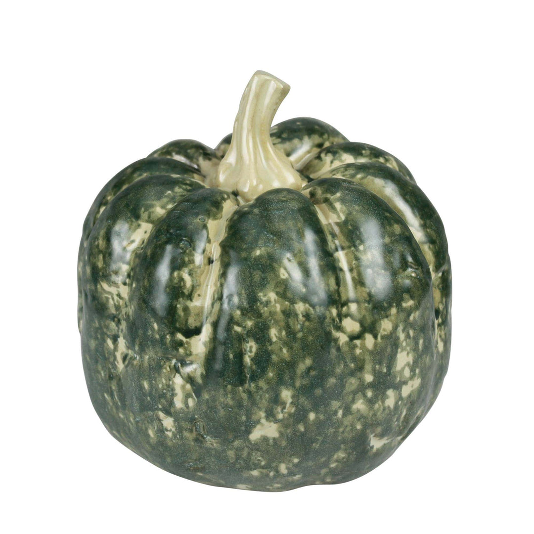 A decorative ceramic pumpkin figurine with a mottled dark green and cream glaze, featuring a textured ribbed surface and a light beige stem, isolated on a white background.