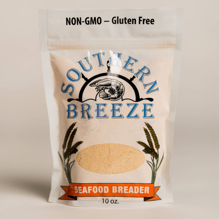 A 10 oz stand-up pouch of Southern Breeze Seafood BREADER, featuring a cream-colored background with blue lettering, a shrimp graphic, and an orange banner at the bottom.