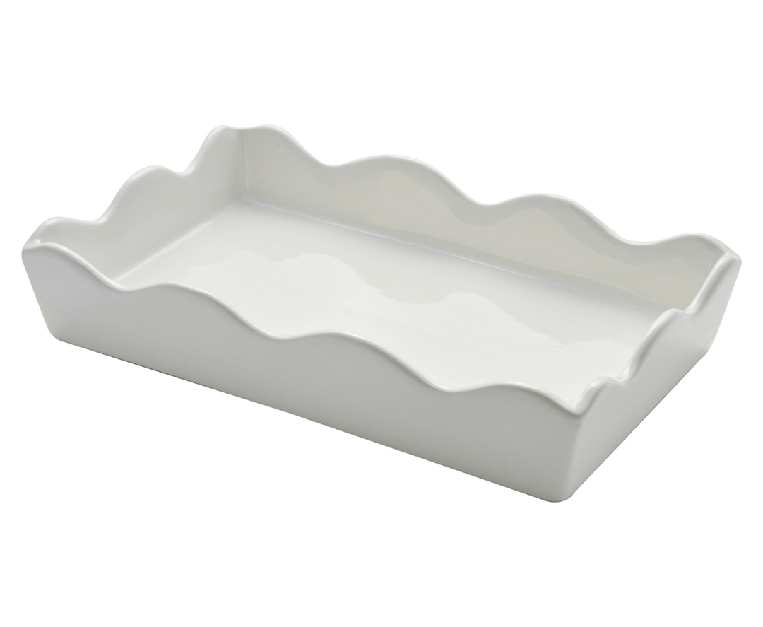 A white rectangular ceramic guest napkin holder with a scalloped rim, shown on a plain white background.
