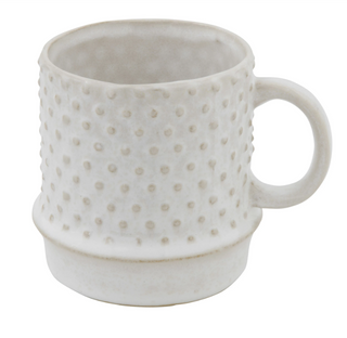 This stoneware mug is a stylish way to serve coffee or tea while entertaining. The fun hobnail design gives it an update look with a vintage feel. The white finish allows it to mingle nicely with other tableware of varying colors.