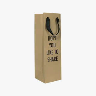 The perfect bag to pair with the drink that you almost kept for yourself. Bag that bottle with this 15” x 4.5” x 4.5” kraft paper gift bag, featuring a cloth handle (no strings attached!). Made & Printed in the USA. 