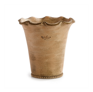 Designed by master potter Peter Wakefield and handmade in Honduras. Terracotta with a ruffled opening and beaded detail along the bottom, the Festonee is a feminine design. Use as cachepot or plant directly into. Protect fine furniture by lining interior of pot. Protect from frost and freezing. Dimensions: Large - 8.5 x 8.5 x 9; Small - 7 x 7 x 7