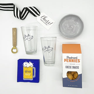 As a small business, we appreciate the #shoplocal movement. We also love to support other small businesses and try to include them when we curate our collections. This "Drink Local" box includes two North Carolina pint glasses, Piedmont Pennies from Charlotte (subject to availability), a bitty bowl from Eastern North Carolina, a brass and mango wood bottle opener and drink local cocktail napkins. Perfect hostess, groomsman, birthday or thank you gift.