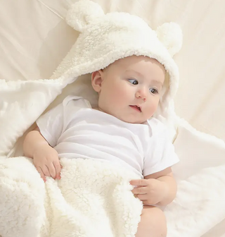 This sweet little baby swaddle is made of soft sherpa fleece and perfect for keeping your little one warm.  Newborn.