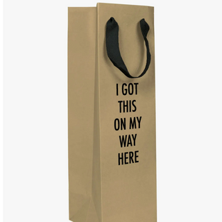 The perfect bag to pair with the drink that you almost kept for yourself. Bag that bottle with this 15” x 4.5” x 4.5” kraft paper gift bag, featuring a cloth handle (no strings attached!). Made & Printed in the USA. 